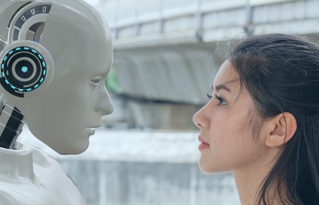 Woman and robot looking into each others eyes